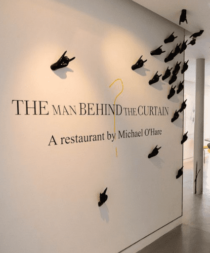 The Man Behind the Curtain reception wall art