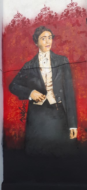 Anne Walker Gentleman Jack mural on the gable end of the Ring o' Bells Pub near Halifax Minster