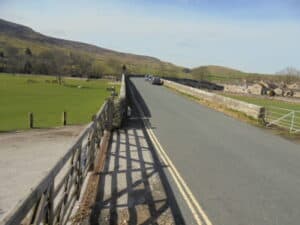 Free road parking -  B6160 Burnsall Bridge BD23 6BY. looking towards Red Lion Burnsall from Appletreewick